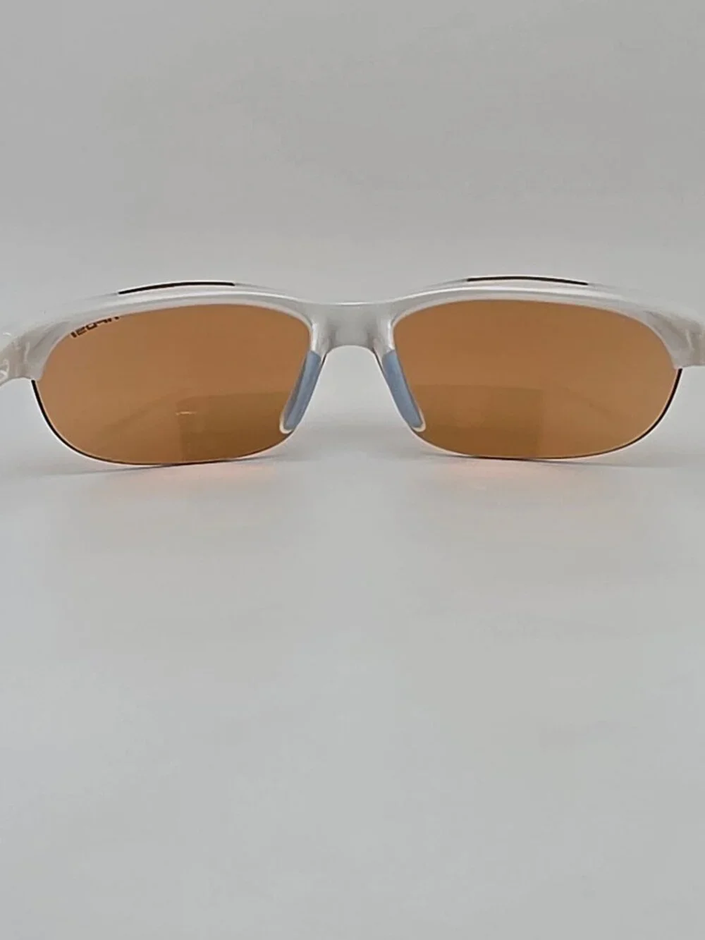 Tifosi Wisp Pearl White Baby Blue Frame Purple Mirror Lens Rimless Sunglasses